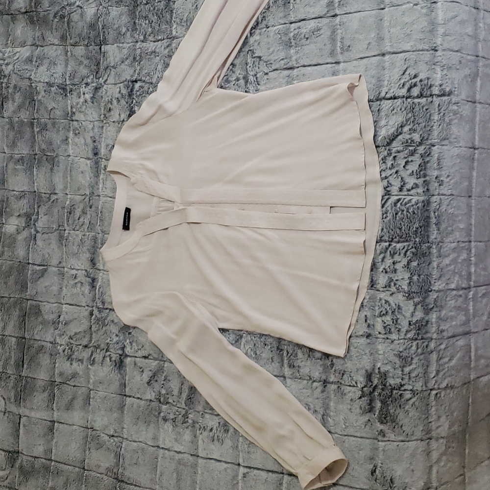 Long sleeved cream blouse